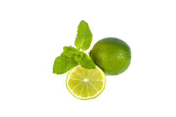 Sliced lime and mint on a white background