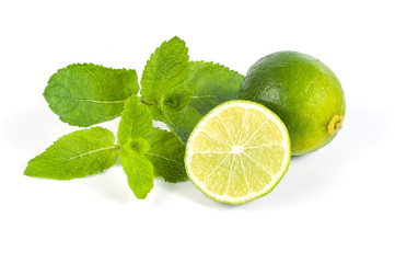 Sliced lime and mint on a white background