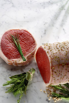 raw beef tournedo on marble
