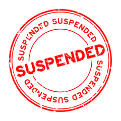 Grunge red suspended round rubber seal stamp on white background