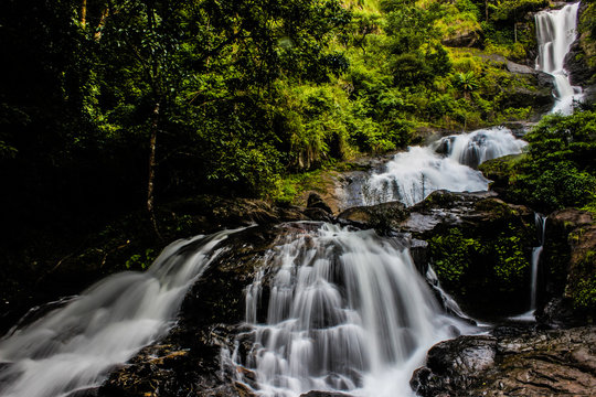 Beautiful Iruppu waterfalls in Karnataka, India. Western ghats , creative blur, long exposure. Green trees & forest. Milky waterfalls