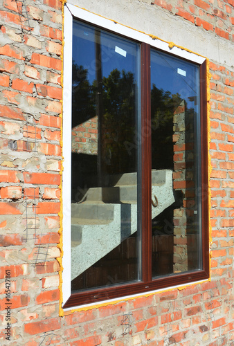 Plastic Window Insulation With Spray Foam On Construction Plastic Window Insulation With Spray Foam On Construction Site