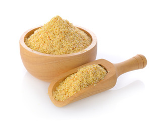 Wheat germ in a bowl and scoop on white background