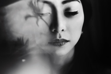 Blurred picture of stunning Asian woman with tender lips