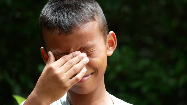 Close up face boy cry.