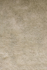 Rough cement wall surface.