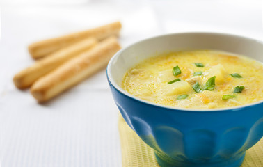 Cheese soup with chicken, potatoes and turmeric