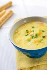 Cheese soup with chicken, potatoes and turmeric
