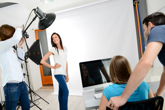 group of four photographer student learning creative portrait during photo shooting in photography school studio
