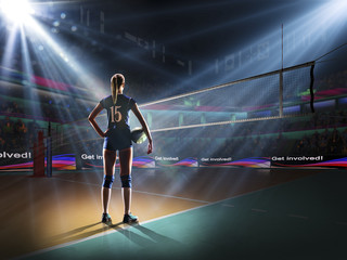 Fototapeta na wymiar Female professional volleyball player on grand court
