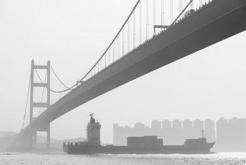 Cargo ship and Tsing Ma Bridge in Hong Kong