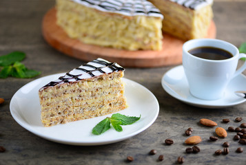 Delicious piece of esterhazy cake (torte). Morning cup of coffee with dessert. Background with a copy space.