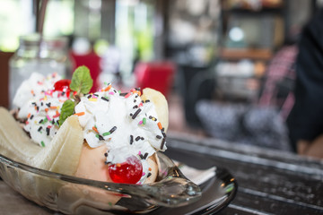 Ice cream sweetened frozen food typically of different colors and flavors with berries, nuts and fruits decoration on bowl at coffee shop for serve