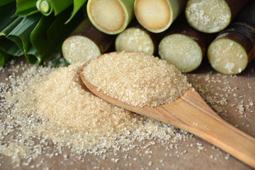 Brown sugar from sugarcane on  wooden table,Agriculture Industry concept.