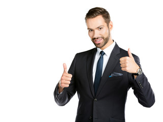 Smiling businessman with thumbs up.