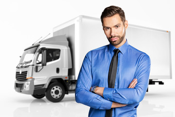 Fototapeta na wymiar Businessman standing in front of a truck.