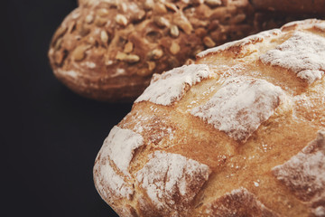 Bakery concept. Plenty of bread background isolated on balck