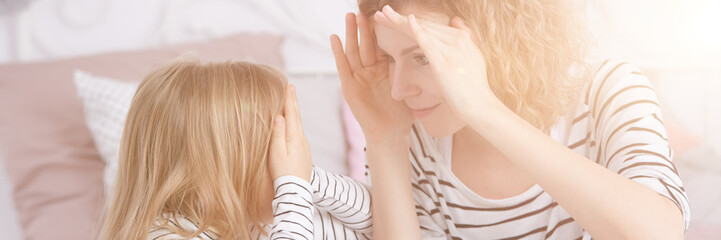 Woman playing with daughter