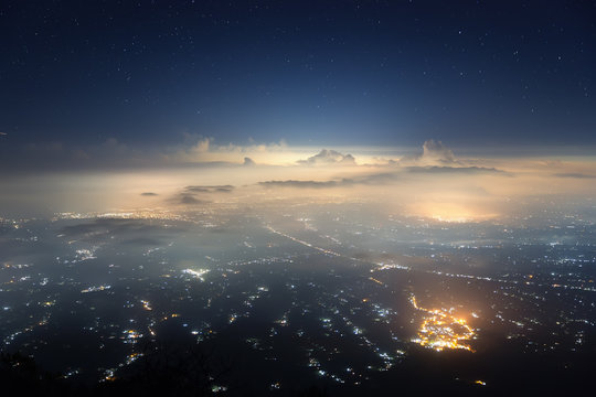 City of stars. View of Bali island from Agung volcano in the night.