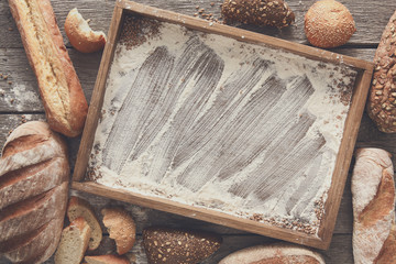 Bread bakery background. Brown and white wheat grain loaves comp