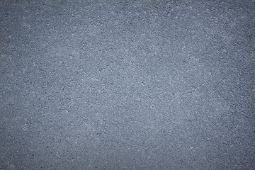 Blue background texture of rough asphalt, top view, copy space