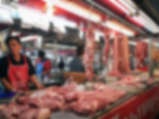 Fototapeta na wymiar blurred image of meat shop in street market for background