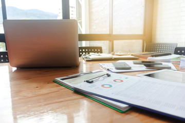 Office workplace with laptop and smart phone on wood table