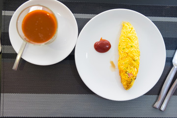Omelette egg on white plate