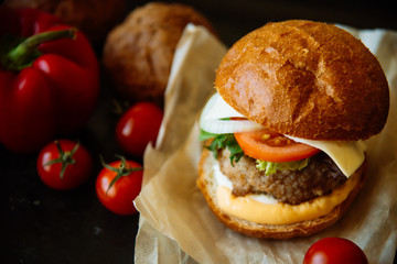 Delicious fresh homemade burger on a wooden table