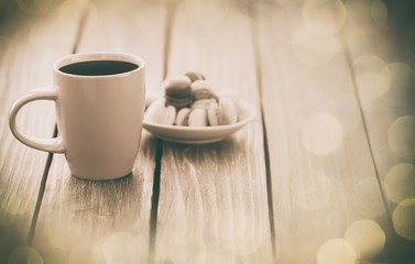 Fototapeta na wymiar Cup of coffee and macarons
