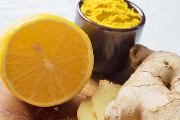 Spices and herbs in ceramic bowls. curcuma and ginger seasoning. Colorful natural additives.