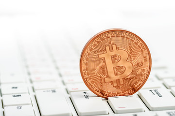 Bitcoin on white keyboard