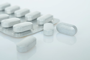 Pharmacy theme, white medicine tablets antibiotic pills.