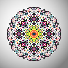 Ornamental round colorful geometric pattern in aztec style