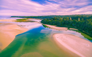 Aerial view of ocean coastline in Australia at low tide with copy space