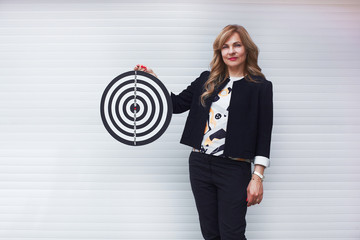 Woman with target as way to goal concept