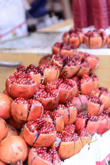 Fresh pomegranate fruit ready made pomegranate  juice on display street juice shop in street food market, Bangkok, Thailand