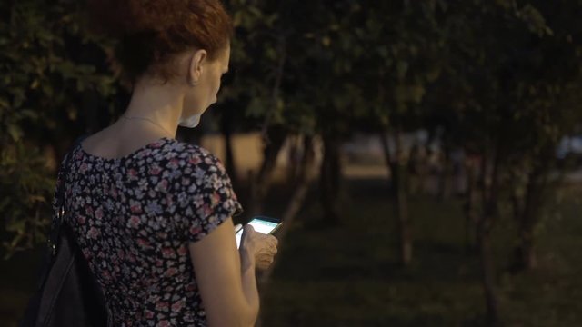 Woman using cellphone outdoor