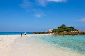 white sand beach and clear water and nice blue sky 