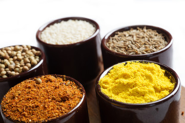 Spices and herbs in ceramic bowls. seasoning. Colorful natural additives.