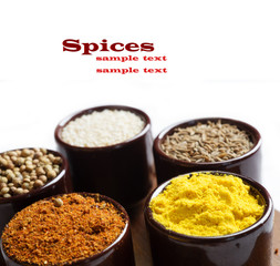 Spices and herbs in ceramic bowls. seasoning. Colorful natural additives.