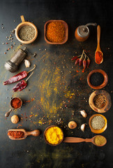Spices, herbs and  condiments on a table in a spoon