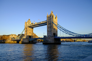 Fototapeta na wymiar Late afternoon winter sunshine on iconic Tower Bridge in London England