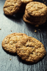 Biscuit sweet cookie background. Domestic stacked butter biscuit pattern concept,close up macro.Homemade cookies on wooden table.Cereal biscuits with the sesame,peanuts,sunflower and amaranth.