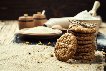 Biscuit sweet cookie background. Domestic stacked butter biscuit pattern concept,close up macro.Homemade cookies on wooden table.Cereal biscuits with the sesame,peanuts,sunflower and amaranth.