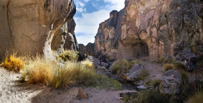 A gorge with the entrance to the Sumbay Cave, which is famous for the rupestrian art from the Paleolithic period, Arequipa departement, Southern Peru