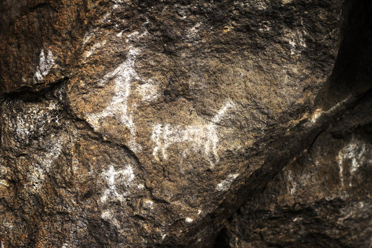 A group of hunters haunts the lama, rupestrian rock art in Sumbay Cave from paleolithic era (6000-8000 BC), Arequipa departement, Southern Peru