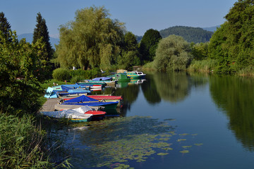 Colorful small boats moored at the bank of the river