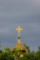 Orthodox cross on a gold dome.