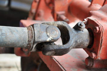 metal steel drive shaft a large size ball bearing support and universal joint with dirty grease